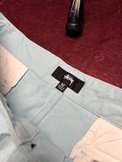 Stüssy cargo pants i lyseblå – str. 32